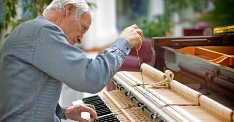 How Much Does It Cost To Tune A Piano? [& Things To Consider]