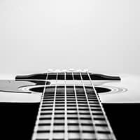 What does legato mean in music for guitarists