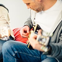 Top strategies for marketing offline and online guitar lessons for guitar teachers